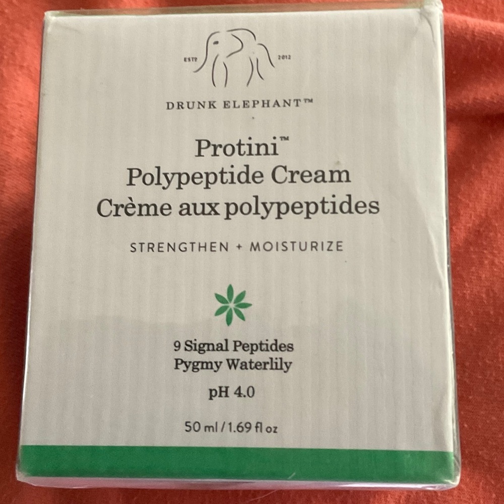 Drunk Elephant Facial Moisturizer with Green Text